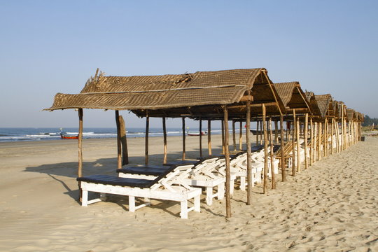 Shaded beach beds at Mandrem beach Pernem Goa, India