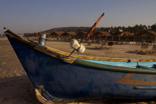 Small fishing boat at Mandre beach in North Goa, India