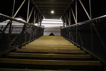 Fototapeta premium look at the stairs from the top corner down at night