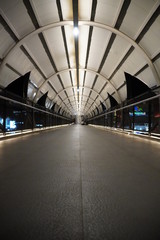 the view of the pedestrian bridge at night