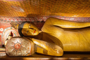 Buddha laying statue in Buddhist Dambulla cave temple (Golden Temple of Dambulla), Sri Lanka