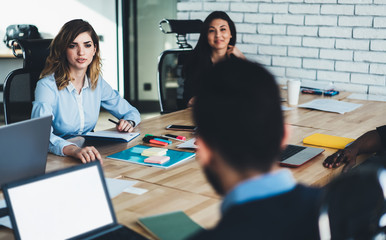 Colleagues during briefing in boardroom