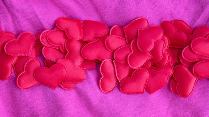 Hearts on a pink background, top view. Pink background with hearts for Valentine's day or...