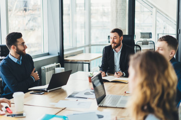 Business people negotiating about project on boardroom