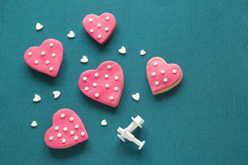 Composition with decorated heart shaped cookies and space for text on blue background, top view. Valentine's day