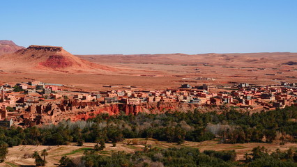 Bright landscape of Morocco, breathtaking curves of mountains, stunning combination of hills & farm land,inadvertent distribution of houses & huts, raw impression of pure nature.