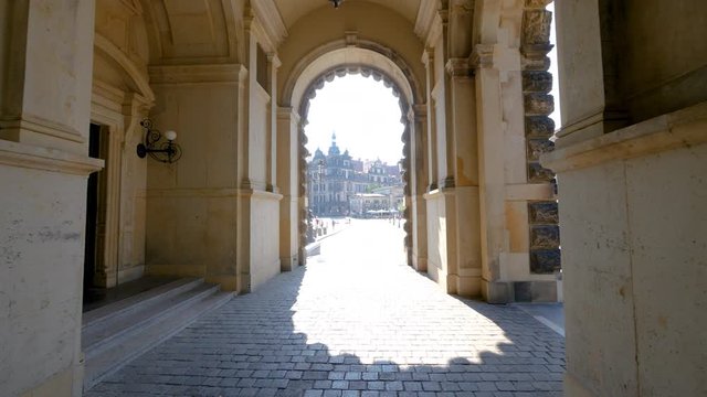 View of Dresden Frauenkirche through the Zwinger archway in Dresden, Germany, featuring magnificent Baroque architecture and one of the city's most iconic landmarks
