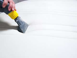 Mattress dry cleaning with professional extraction method. Close up.