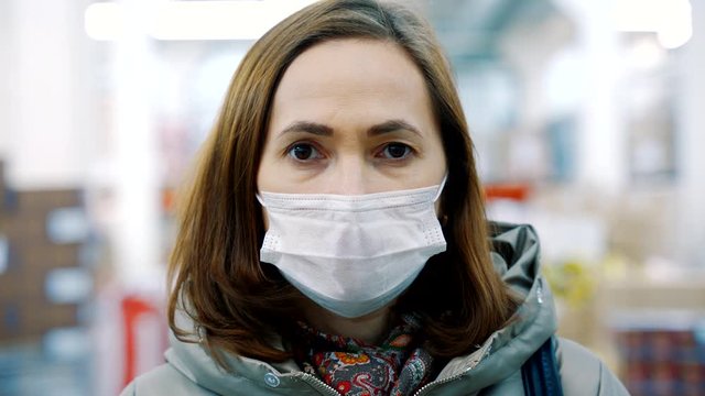 Portrait of a woman in protective medical mask.. Health care and medical concept.