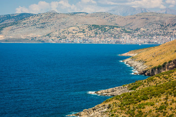 Fototapeta na wymiar Coast of Sarande in Albania with turquoise blue water in the sea