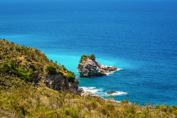 Fototapeta na wymiar Turquoise blue and clear sea on the coast of Albania between Ksamil and Sarande
