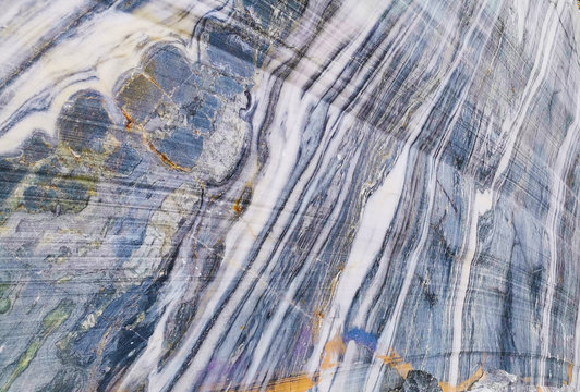 marble wall with blue wite and grey stripes on it.