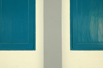 blue wood window on white wall, vintage tone