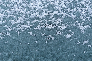 Frosty natural pattern at a winter window