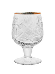 Empty crystal glass for alcohol on a thin leg, isolated on a white background