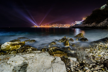 Night photo of Sarande in Albania in background with Mediterranean Sea on long exposure