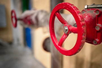 Red valves on hydrant pipelines of security and fire extinguishing systems of modern chemical...