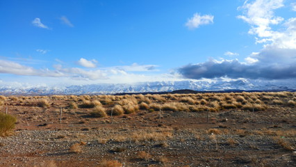 Bright landscape of Morocco, breathtaking curves of mountains, stunning combination of hills & farm land,inadvertent distribution of houses & huts, raw impression of pure nature.