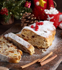 Fototapeta na wymiar traditional European Stollen cake with nuts and candied fruit