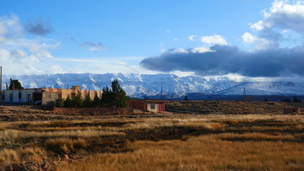 Bright landscape of Morocco, breathtaking curves of mountains, stunning combination of hills & farm...