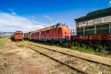 Plakat Perrenjas, Albania - August 07, 2014. Old abandoned locomotives in train station