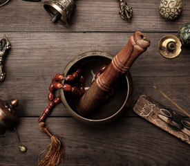 Copper singing bowl, prayer beads, prayer drum and other Tibetan religious objects for meditation