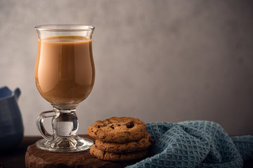 Glass wiss fresh coffee with milk, . Toned photo