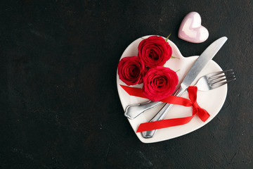 Red rose on white dish. Meal on Valentines Day for the woman you love