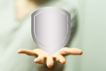 shield protection concept holding in hand