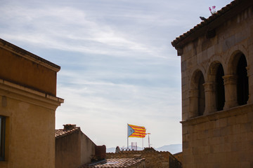 The Estelada (starred flag) symbolizing Catalan independence hanging out of a building in Catalonia