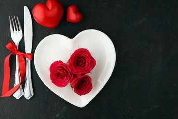 Red rose on white dish. Meal on Valentines Day for the woman you love