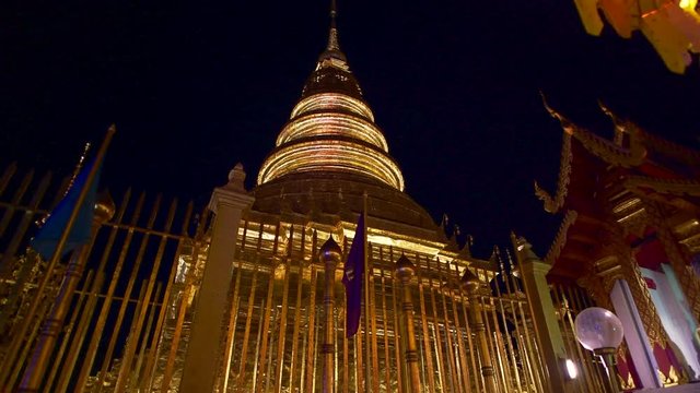 hra That Hariphunchai temple in Lamphun Lantern Festival at night, Thailand.