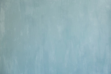 Blue texture painted acrylic wall paint. Light blue background