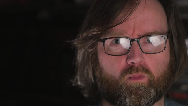 Man with Long Hair And Wearing Eyeglasses, Repeatedly Saying No Without Voice To His Audience, Close Up