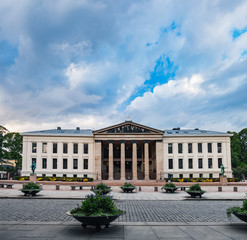 Universitetsplassen square under blue cloudy sky in Oslo, Norway
