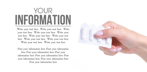 Suppositories in hand health medicine on a white background. Isolation, copy space