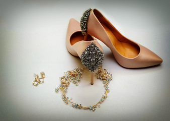 luxurious beige bridesmaid shoes with garter and decoration.The concept of the wedding,the...