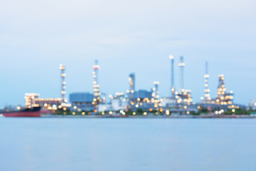 Fototapeta na wymiar Defocus of oil refinery plant at twilight.