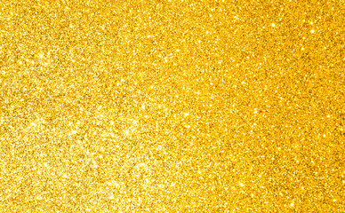 sparkles of golden glitter texture background