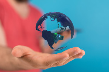 Human Hand Holding The World In Hands.