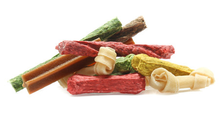 bones and colorful sticks for dog treat with vitamin and oral health on white background