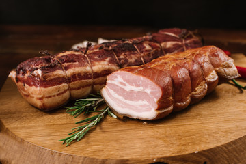 Sliced smoked meat on wooden desk