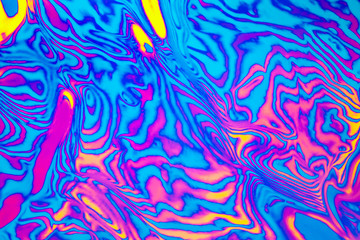 Abstract trendy neon colored psychedelic fluorescent striped zebra textured neon background