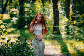 Fototapeta premium ginger charming woman young beautiful forest green