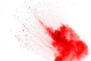 Red powder explosion on white background. Colored cloud. Colorful dust explode. Paint Holi.