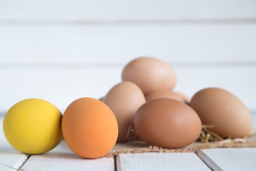 Eggs chicken on white wood background