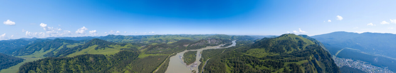 Fototapeta na wymiar Aerial banner panoramic wide view of planet earth with nature and picturesque landscape in Altai mountain with green trees on a summer day and blue sky. Travel and recreation.