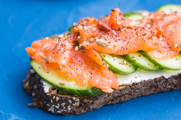 Sandwich with smoked salmon and cucumber. Concept for healthy nutrition.