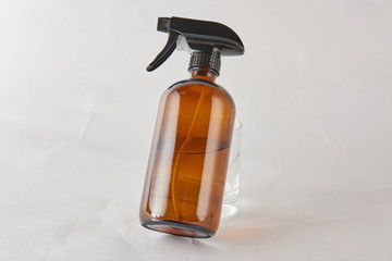 Portable glass bottles of various shapes and colors can hold essential oil, massage oil or...
