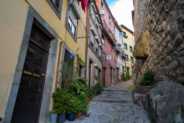 Fototapeta na wymiar narrow street in the old town of Porto Portugal with colorful buildings